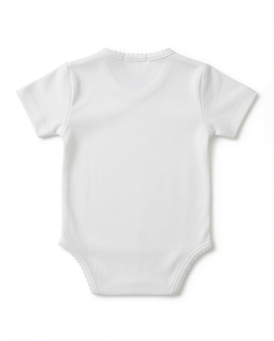 A white short-sleeve baby bodysuit with an asymmetrical wrap-style front and delicate scalloped edges, shown flat against a white background from the back
