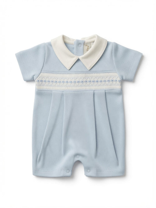 A baby short-sleeve romper in light blue with a white pointed collar and a white smocked chest band, shown flat on a white background.