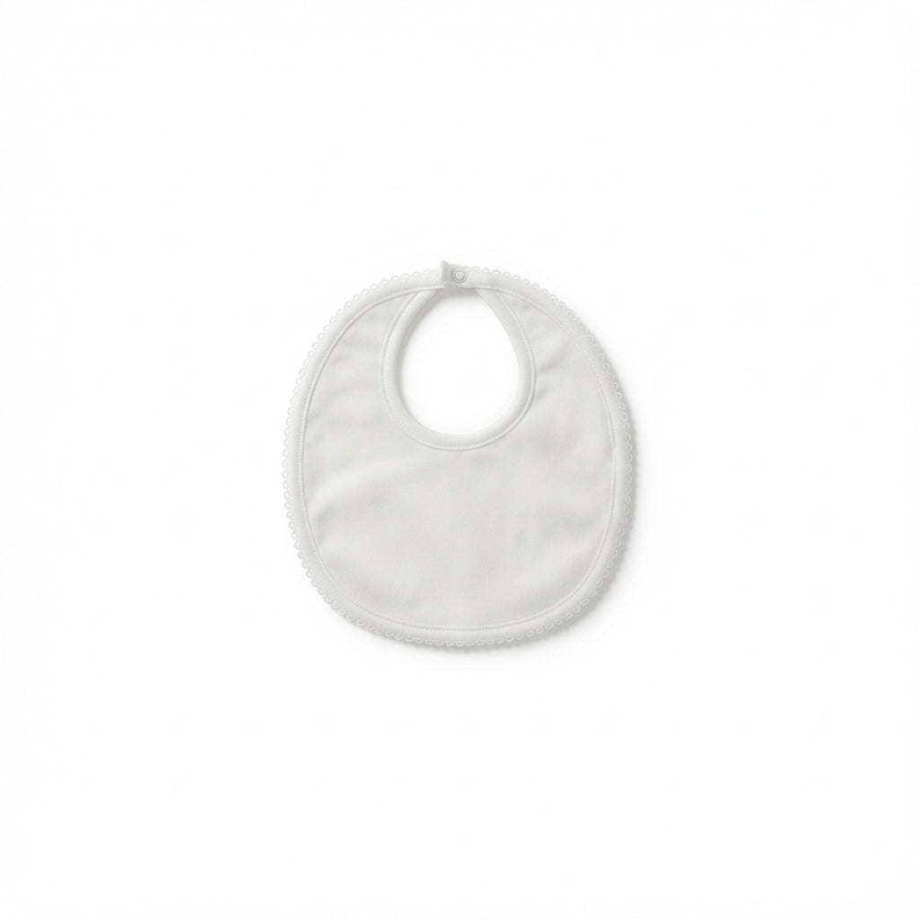 A white fabric baby bib with a rounded shape, a central neck opening, and a small tab at the top, shown on a plain white background.