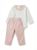 A baby girl's two-piece outfit set featuring a white long-sleeve bodysuit with a pink ruffled collar and a small pink hot air balloon logo, paired with light pink pants.