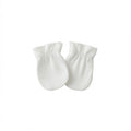 A pair of white baby mittens with picot edges, shown against a plain white background