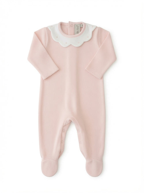 A light pink baby footie with long sleeves, a scalloped white collar, and matching pink foot covers, shown flat on a white background from front side.