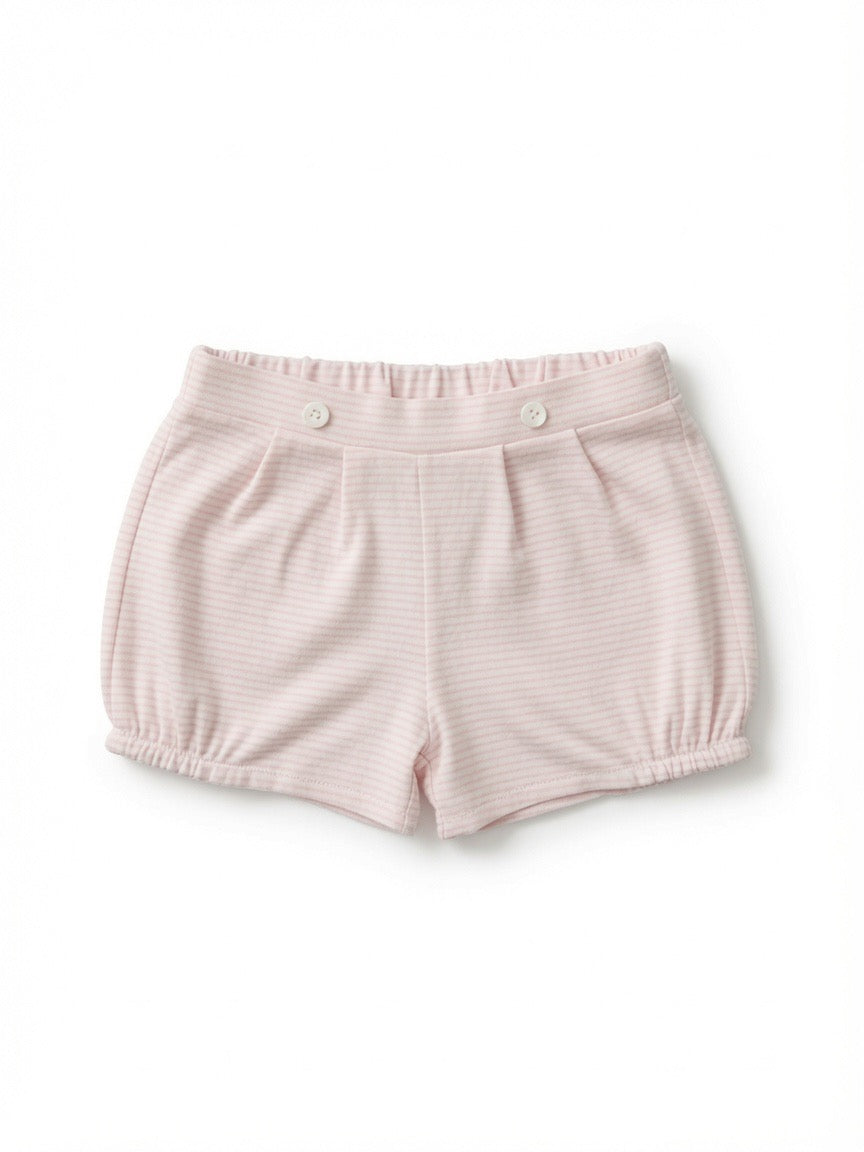 A pair of light pink striped baby bubble shorts with an elastic waistband and two decorative buttons made from Peruvian pima cotton