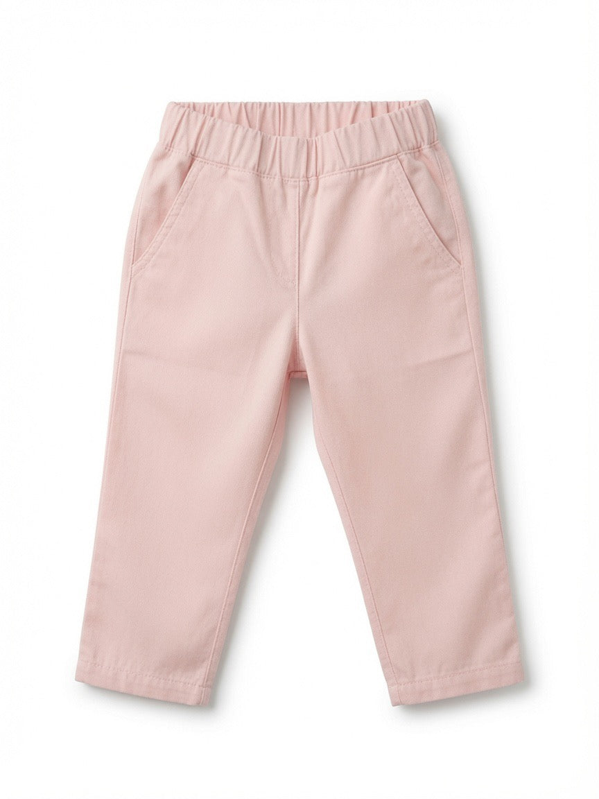 A pair of toddler's light pink pants with an elastic waistband and side pockets, shown flat on a white background.